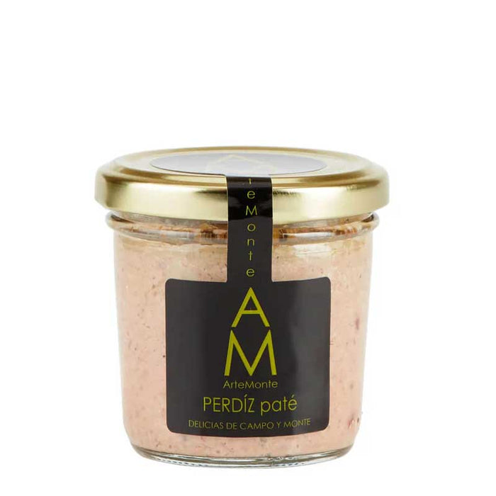 A 100g Spanish jar of ArteMonte Partridge páté with a gold lid with the Spainsh word Perdiz on the label on a white background