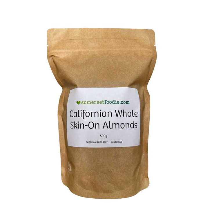 Kraft bag of Californian Whole Skin-On Almonds with a label on a white background.