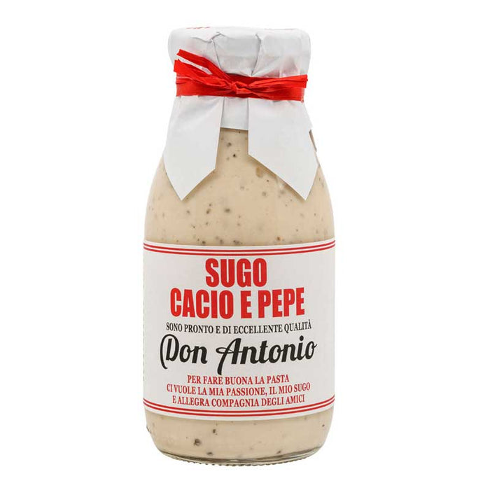 Bottle of Don Antonio Cacio e Pepe with paper around the lid held by a red ribbon on a white background
