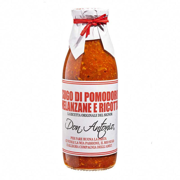 A 500g bottle of Don Antonio Tomato Aubergine and ricotta pasta sauce with attractive paper and red ribbon around the top of the bottle.