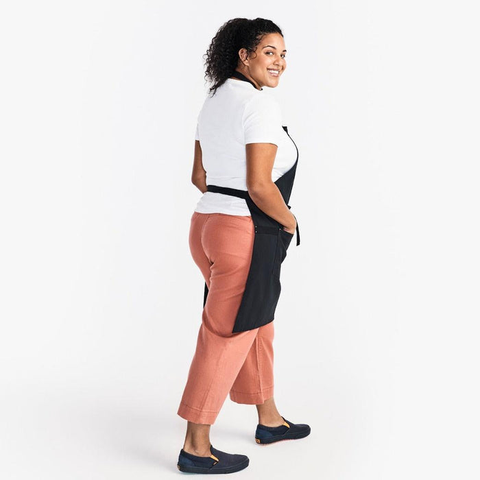 Woman wearing apron back
