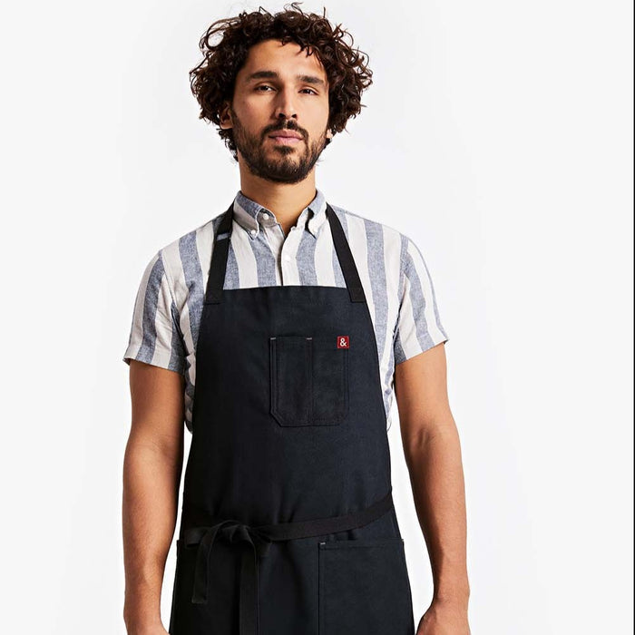 Young man wearing Hedley & Bennett Caviar Essential Apron