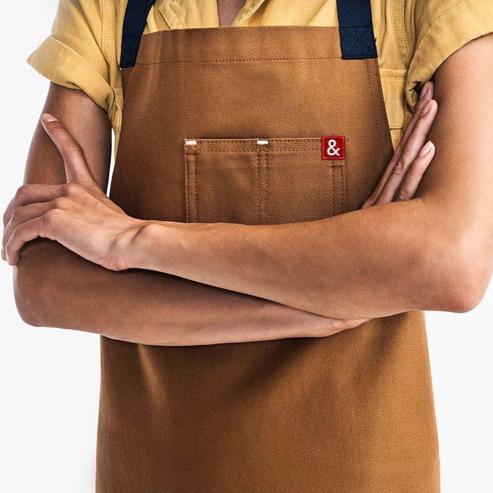 Woman wearing Hedley & Bennett Denver Essential Brown Apron with her arms crossed