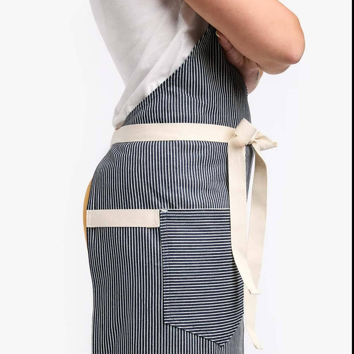 Woman wearing Hedley & Bennett Hickory Striped Apron side view