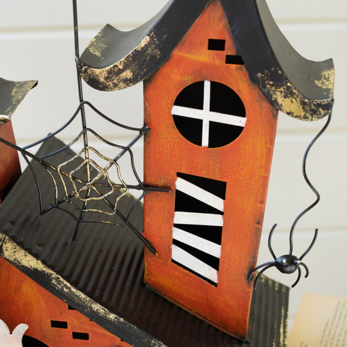 Close up orange halloween house decorations with spider and spiderwebs.