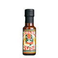 A 125ml bottle of La Chipotlera Salsa Ruda featuring a colourful and serreal illustration of a female Mexican wrestler