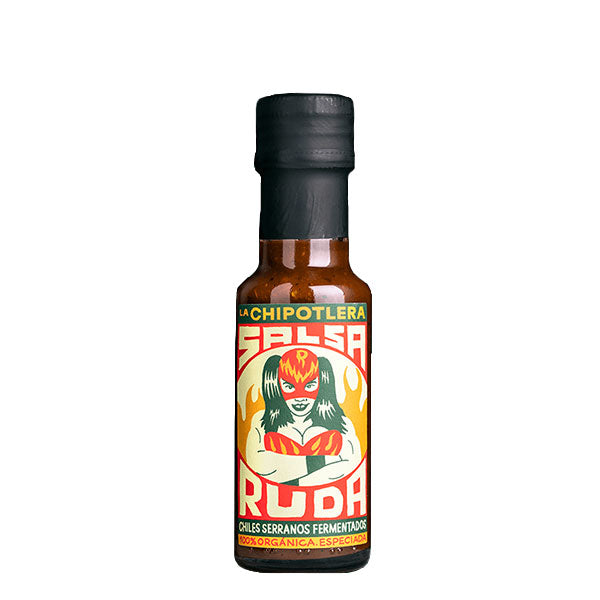 A 125ml bottle of La Chipotlera Salsa Ruda featuring a colourful and serreal illustration of a female Mexican wrestler