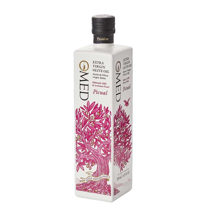 A 500ml white painted glass bottle of O-Med Picual Extra Virgin Olive Oil with a pinlk tree design on a white background
