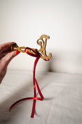Pair of Ornate Brass French Curtain Rod Brackets with Scrollwork and Quatrefoil Piercing