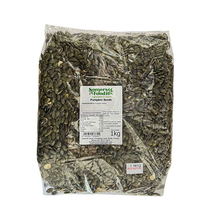 A clear 1kg bag of pumpkin seeds with a Somerset Foodie label on a white background
