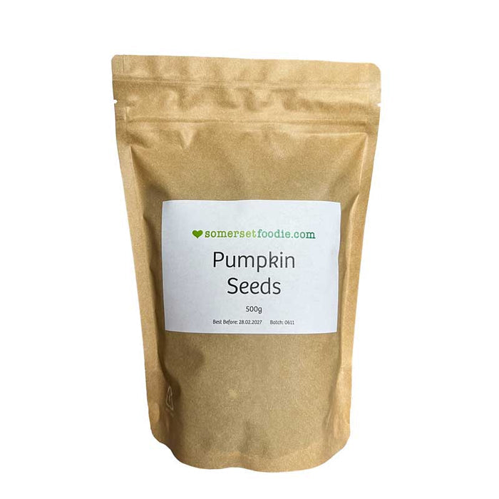 Kraft paper style 500g bag of pumpkin seeds with a label on a white background