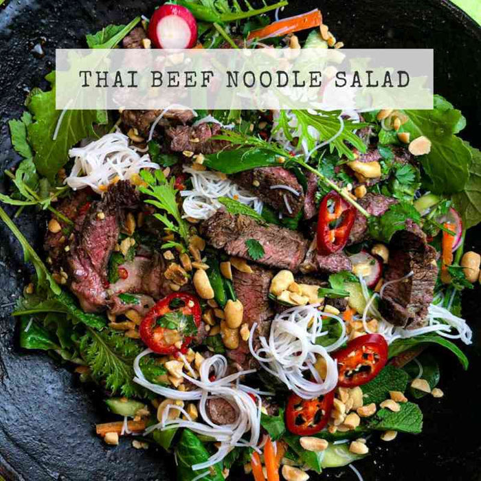Recipe for Thai Beef Noodle Salad; grilled strips of beef with rice noodles, salad leaves, fresh chilli, in a Thai dressing.