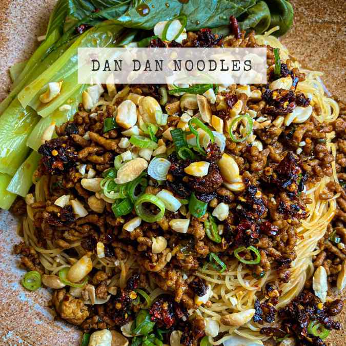 Chinese Dan Dan Noodle Recipe - noodles with sesame sauce, topped with pork, peanuts, spring onions and crispy chilli oil.