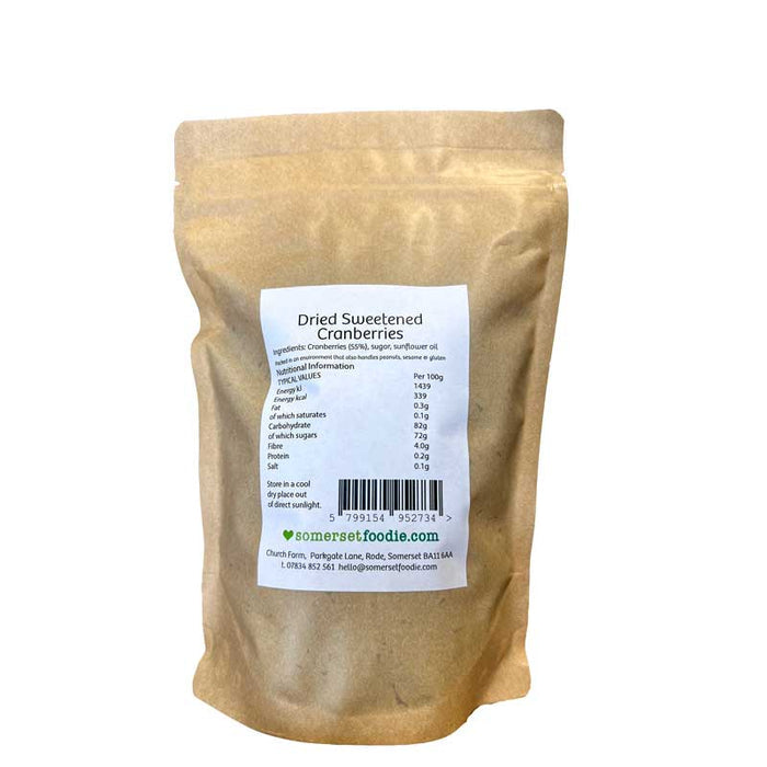 The reverse side of a Somerset Foodie 500g brown Kraft style pouch of dried sweetened cranberries with a label on a white background
