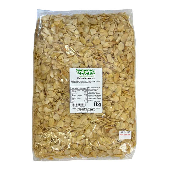 A 1kg  bag of Somerset Foodie Flaked Almonds in clear packaging with a label on a white background