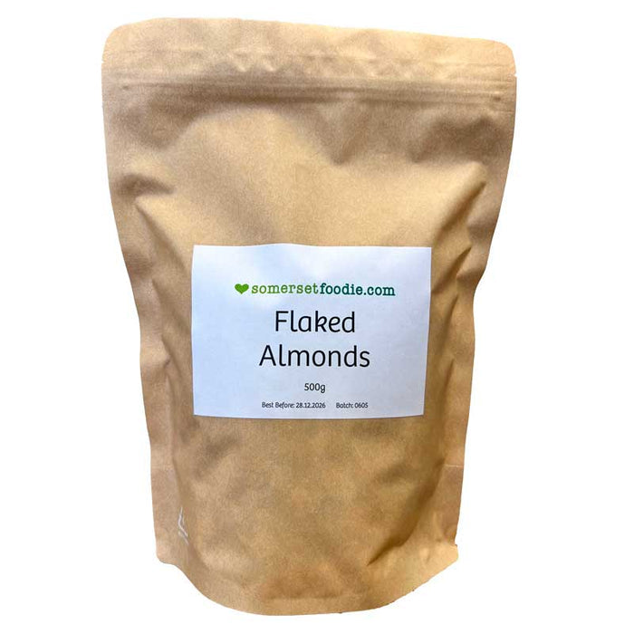 Somerset Foodie 500g Kraft bag of flaked almonds with a label on a white background