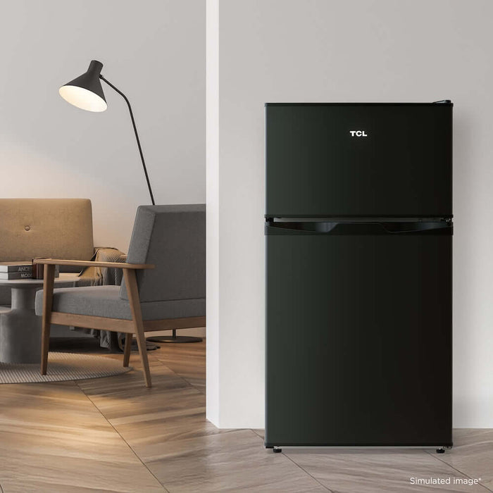 TCL 18 in. 3.1 Cu. Ft. Compact Top Freezer Mini Fridge in Black (TRM31D4AB) in a living room