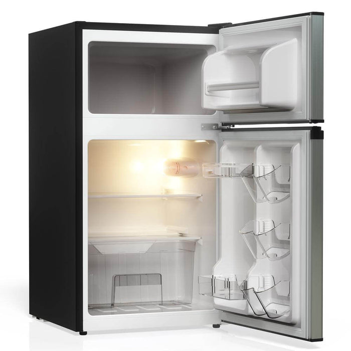 TCL 18 in. 3.1 Cu. Ft. Compact Top Freezer Mini Fridge in Silver (TRM31D4AV) with open door on a white background