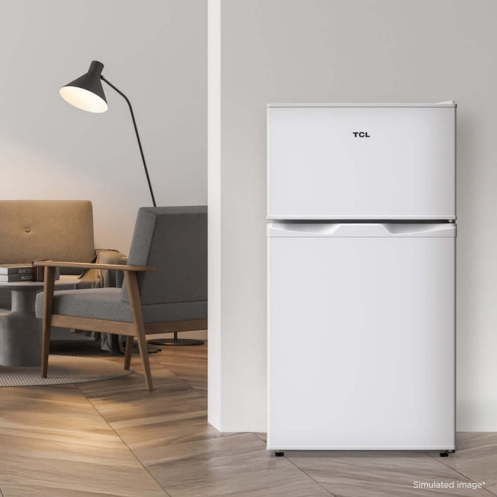 TCL 18 in. 3.1 Cu. Ft. Compact Top Freezer Mini Fridge in White (TRM31D4AW) in a modern living room setting