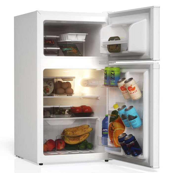 TCL 18 in. 3.1 Cu. Ft. Compact Top Freezer Mini Fridge in White (TRM31D4AW) with open door showing food and drinks on a white background