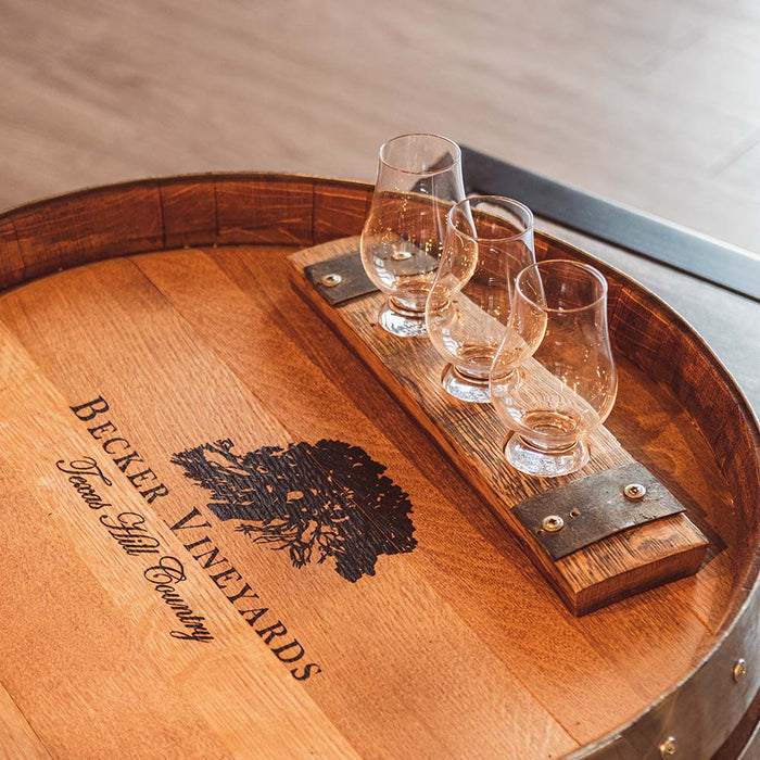 Three glasses on wine barrel serving tray